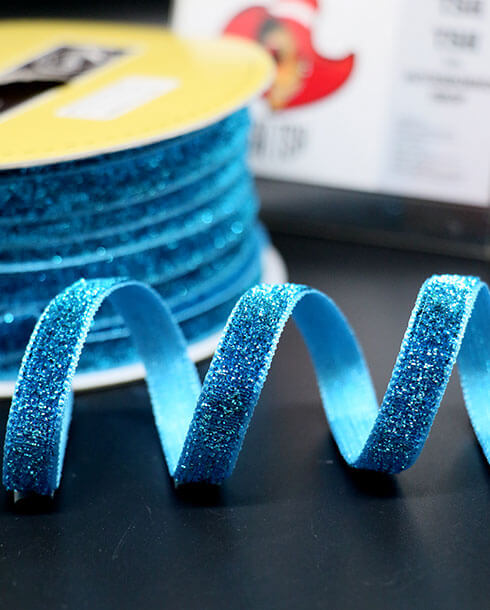 ริบบิ้นผ้ากากเพชร ขนาด 10 มิล สีฟ้า ยาว 36 หลา 