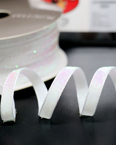 ริบบิ้นผ้ากากเพชร ขนาด 10 มิล สีขาว ยาว 36 หลา 