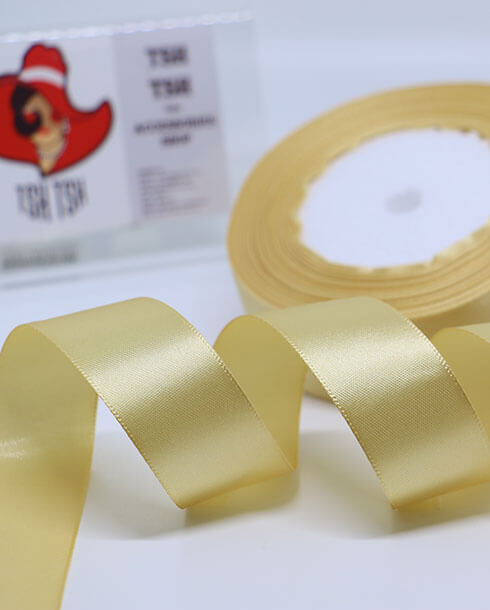 ริบบิ้นผ้าซาติน ขนาด 1 นิ้ว สีครีมทอง เงา 1 หน้า ยาว 25 หลา #87